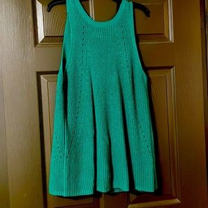 Sweater, tank top style with open back.